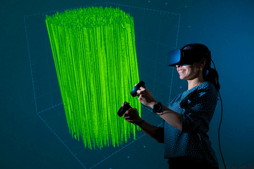 Juliana Martins de Souza e Silva can use a virtual reality headset to “fly” through tiny samples of materials.